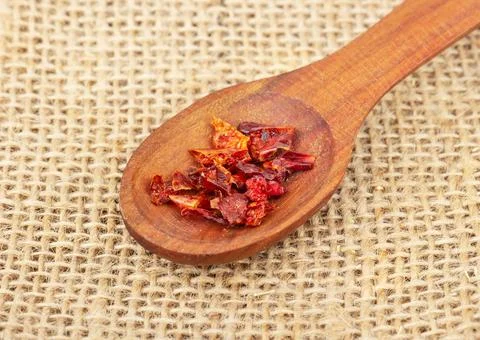 Dry red pepper in spoon Stock Photos