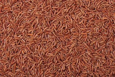 Dry red rice texture background Stock Photos