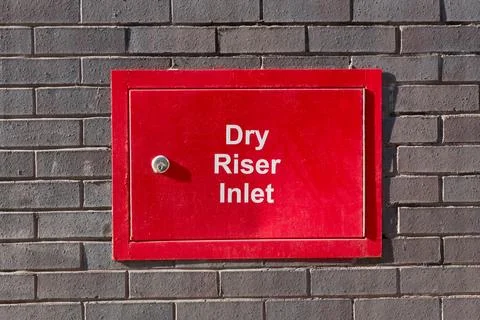 Dry riser inlet cabinet located on building Stock Photos