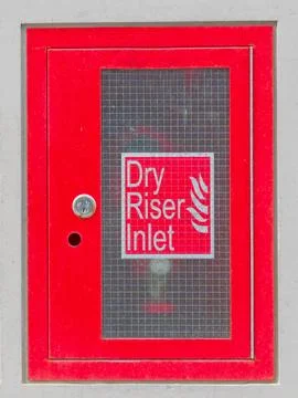 Dry riser inlet cabinet located on building Stock Photos