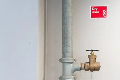 Dry riser landing valve within office building Stock Photos