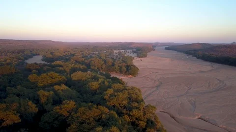 Dry river border forest zimbabwe botswana aerial drone Stock Footage 98948420
