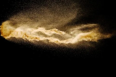 Dry river sand explosion isolated on black background. Abstract sand cloud... Stock Photos