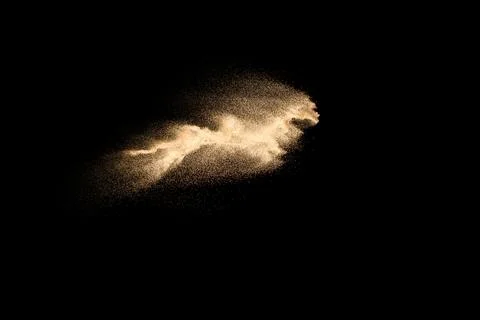 Dry river sand explosion isolated on black background. Abstract sand cloud... Stock Photos