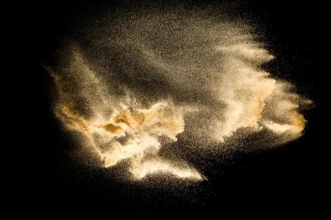 Dry river sand explosion isolated on black background. Abstract sand cloud... Stock Photos
