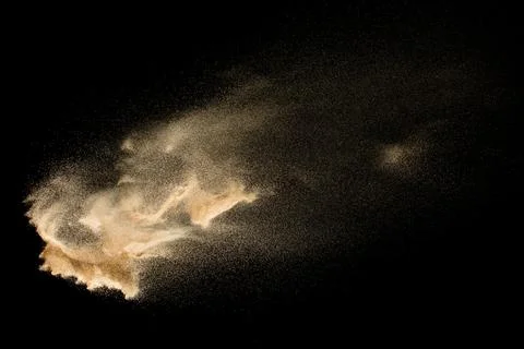Dry river sand explosion isolated on black background. Abstract sand cloud... Stock Photos