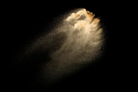Dry river sand explosion isolated on black background. Abstract sand cloud... Stock Photos