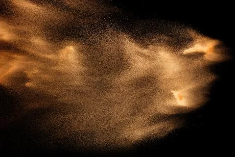 Dry river sand explosion isolated on black background. Abstract sand cloud... Stock Photos