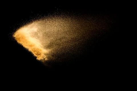 Dry river sand explosion isolated on black background. Abstract sand cloud... Stock Photos