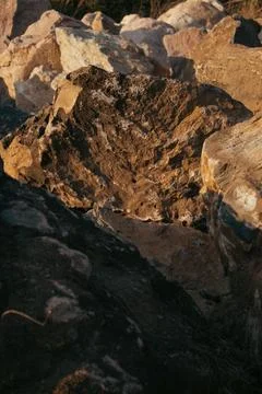 Dry rocks with the reflection of the sunset Foto stock