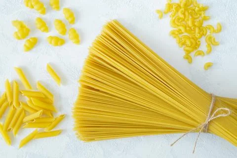 Dry several types of pasta on a light background Stock Photos