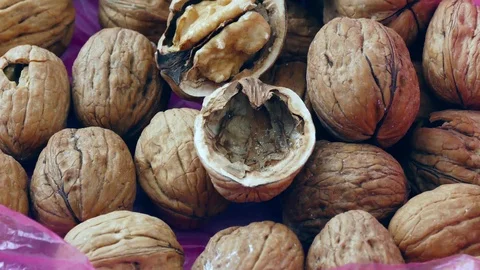 Dry shelled walnuts and nutcracker in the bag, Stock Footage 104570760