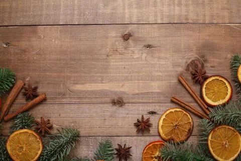 Dry slices of oranges lying on the table. Decorative ornament. C Stock Photos