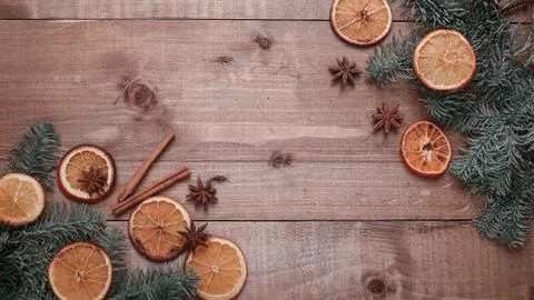 Dry slices of oranges lying on the table. Decorative ornament. C Stock Photos