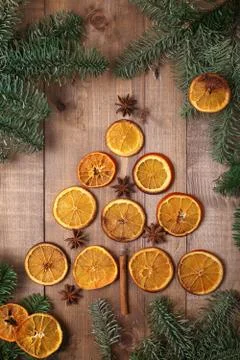 Dry slices of oranges lying on the table. Decorative ornament. C Stock Photos