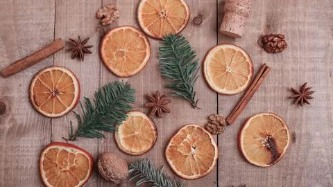 Dry slices of oranges lying on the table. Decorative ornament. C Stock Photos