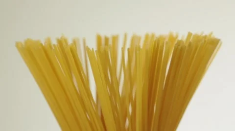 Dry Spaghetti being twisted Stock Footage 44418976