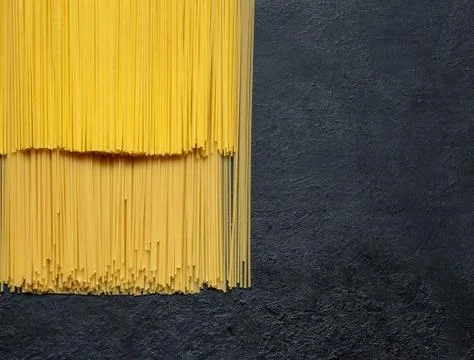 Dry spaghetti close up on a black background Stock Photos