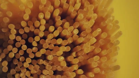 Dry spaghetti close up, macro view of pasta. Yellow food, carb diet, Italian coo Stock Footage 224290270