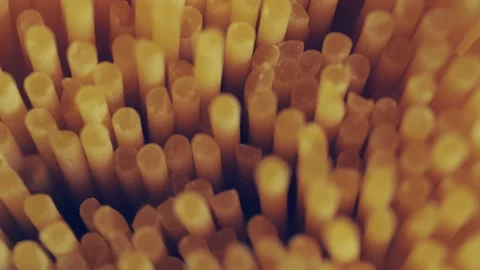 Dry spaghetti close up, macro view of pasta. Yellow food, carb diet, Italian coo Stock Footage 224291198
