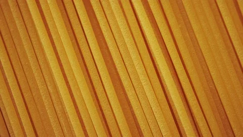 Dry spaghetti close up, macro view of pasta. Yellow food, carb diet, Italian coo Stock Footage 224291258