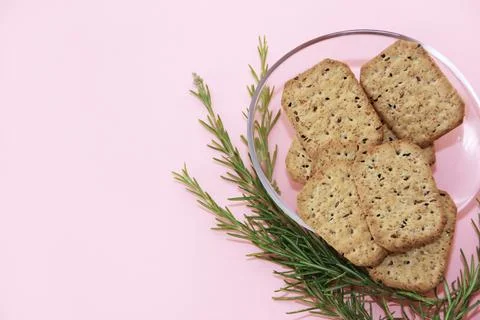Dry square diet crackers with black cumin seeds and quinoa Stock Photos