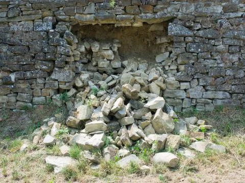 Dry stone wall collapsed  requires restoration work Stock Photos