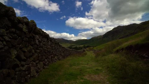 Dry stone wall leading into the mountains Stock Footage 346921301