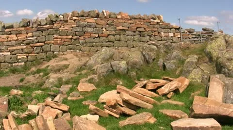 Dry stone wall repaired at Hadrian's Wall, panning left Stock Footage 22384996