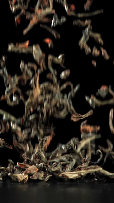 Dry tea falls on the table. Filmed on a high-speed camera at 1000 fps Stock Footage 335363215