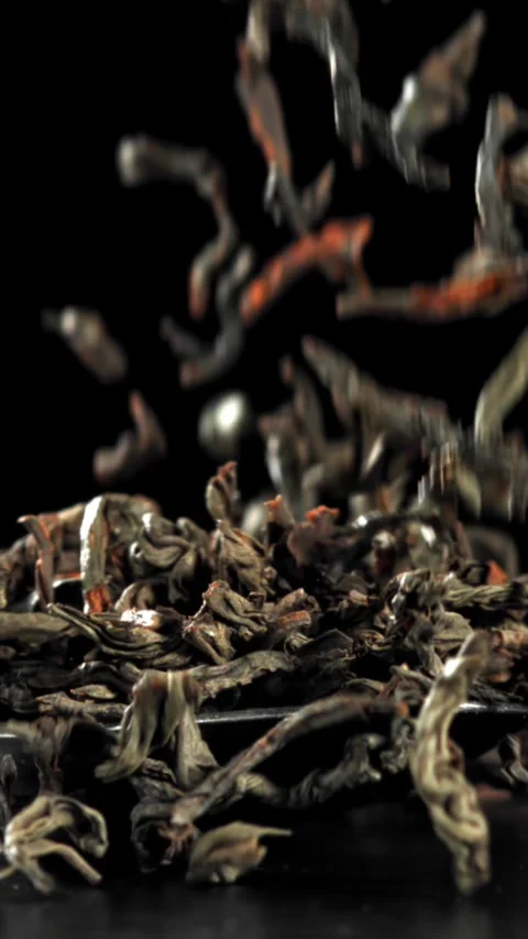 Dry tea falls on the table. Filmed on a high-speed camera at 1000 fps Stock Footage 335364887