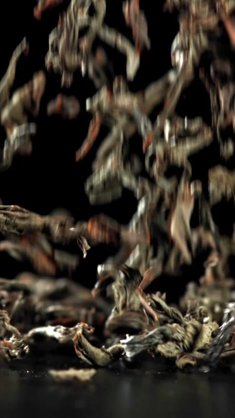 Dry tea falls on the table. Filmed on a high-speed camera at 1000 fps Stock Footage 335368576