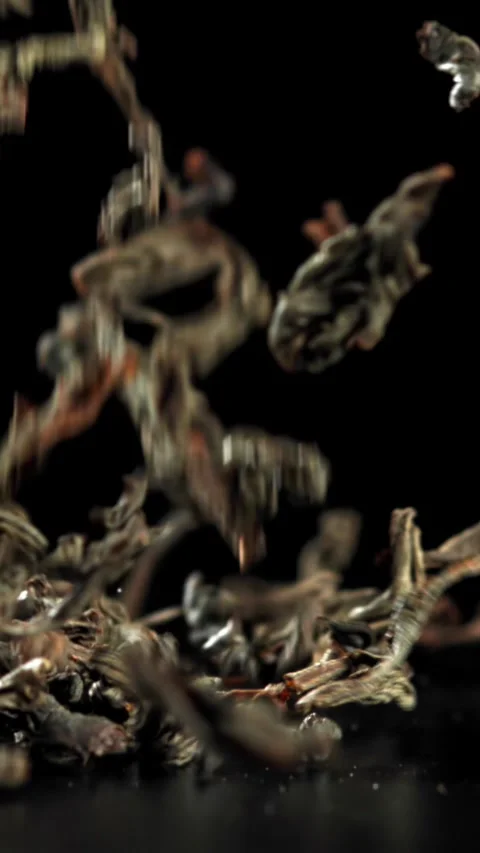 Dry tea falls on the table. Filmed on a high-speed camera at 1000 fps Stock Footage 335371721