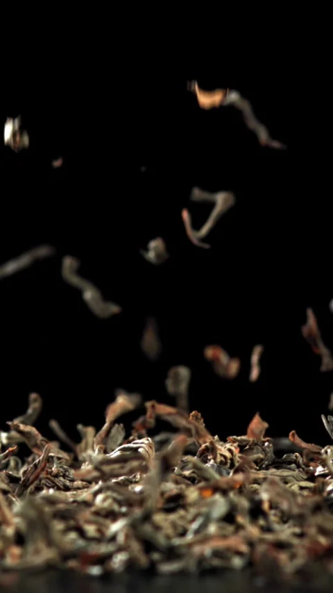Dry tea falls on the table. Filmed on a high-speed camera at 1000 fps Stock Footage 335380648