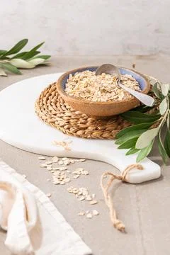 Dry thick oat flakes in a ceramic bowl in kitchen counterto. Concept of hea.. Stock Photos