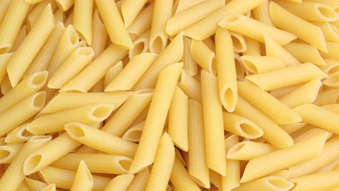 Dry uncooked Italian macaroni rotating close up. Stock Footage 179662907