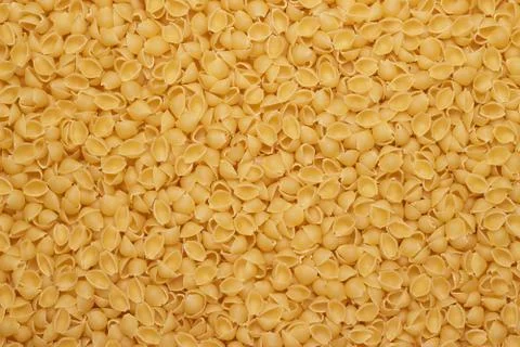 Dry uncooked macaroni texture background Stock Photos
