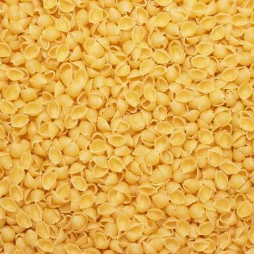 Dry uncooked macaroni texture background Stock Photos