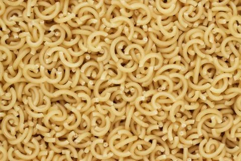 Dry uncooked pasta texture background Stock Photos