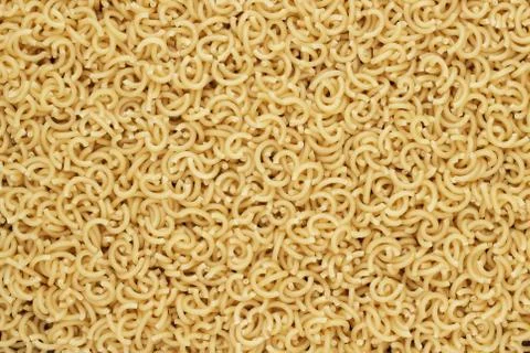 Dry uncooked pasta texture background Stock Photos
