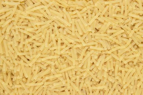 Dry uncooked pasta texture background Stock Photos