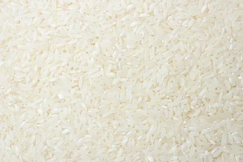 Dry Uncooked White Rice Background Stock Photos