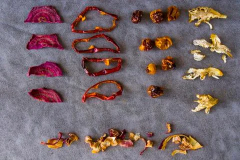 Dry vegetables on the table red pepper, beet root, date, mushroom Stock Photos