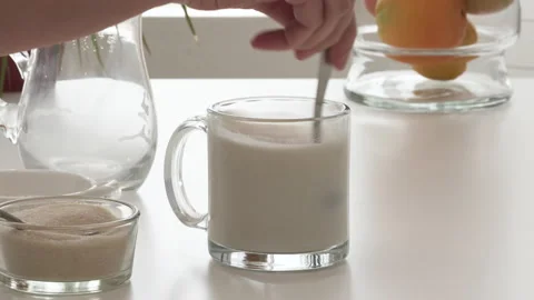 Dry yeast dissolved in warm milk. Baking process, bread dough recipe.  Stock Footage 138267176