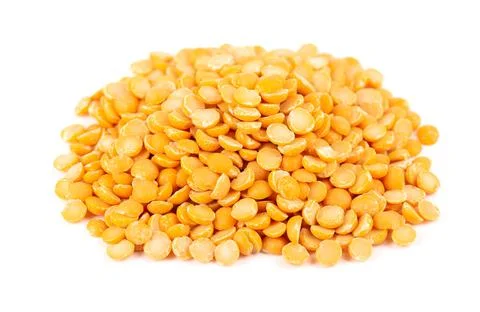 Dry yellow split peas isolated on white background. Halves of yellow legume peas Stock Photos