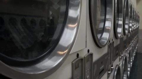 Dryer machines in a laundrymat Stock Footage 53789752