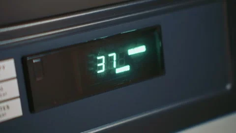 Dryer remaining cycle time displayed on digital screen Stock-Footage 335490791