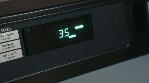 Dryer timer displaying remaining cycle time clearly Stock-Footage 335490991