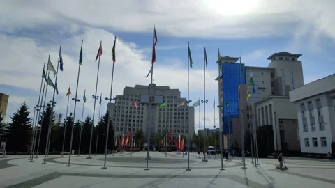 Drygin Square on warm spring day. Flags of Russia and municipalities of region Stockbeeldmateriaal 314914236
