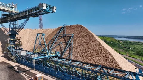 Drying and storage of wood chips in piles. General view of the paper mill Stock Footage 321667858